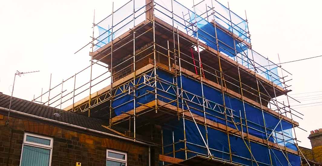 brook scaffolding company finishing scaffold erection on a residential home