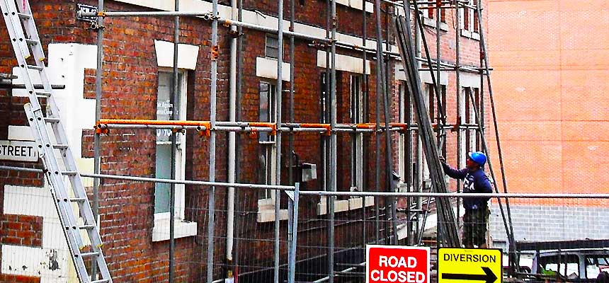 distance view of brooks scaffolders installing scaffolding around a very large scale commercial retail property in sheffield