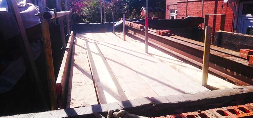 scaffold erected inside a buildings ceneter to support workers and materials during building renovations