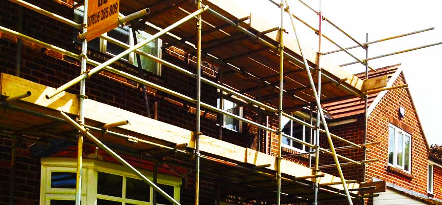 scaffold being installed on a small brick built family home