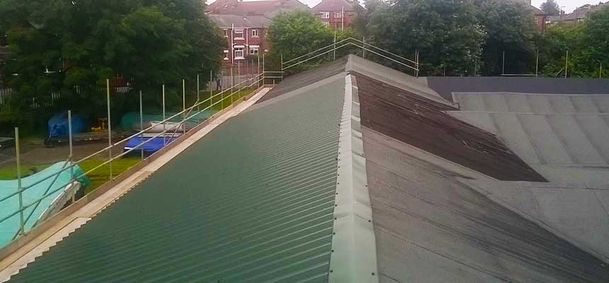 emergency scaffolding team repairing damaged scaffolding on a sheffield factory used for manufacturing